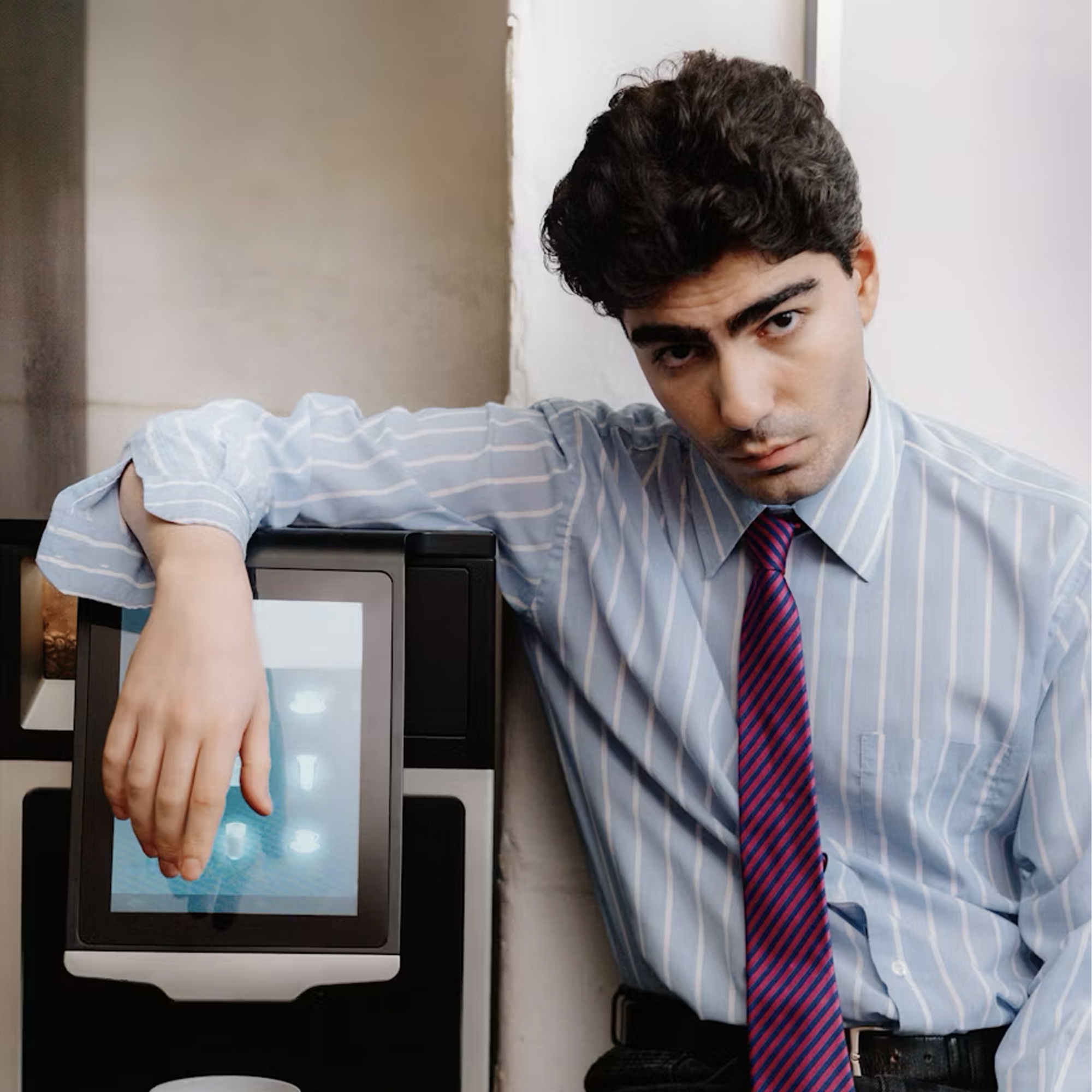 Executive at coffee machine